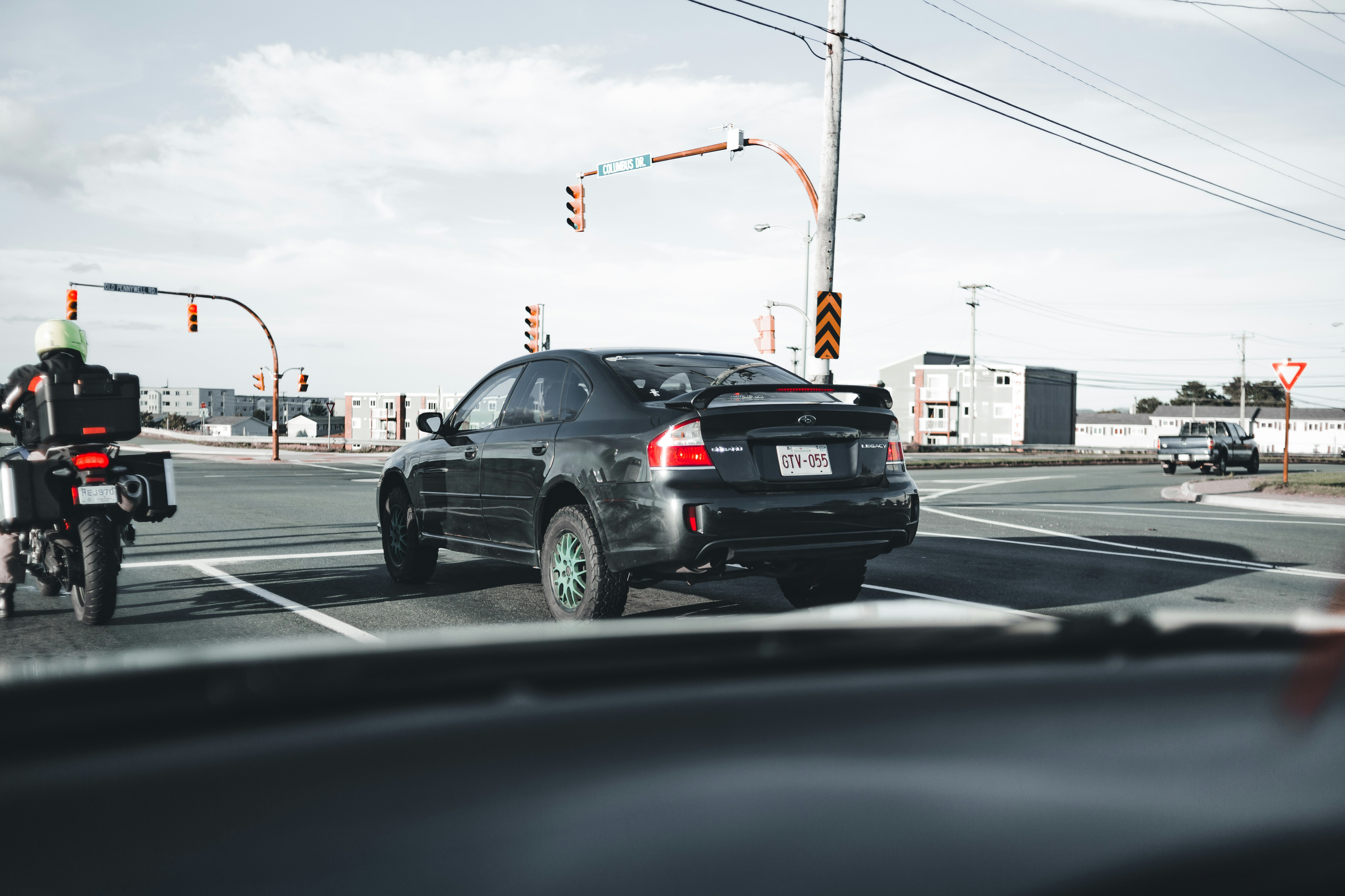 black honda sedan on road during daytime