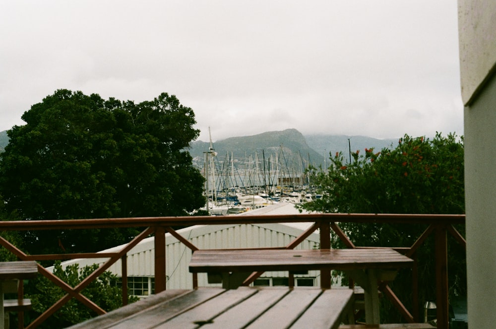 a wooden table sitting on top of a wooden deck