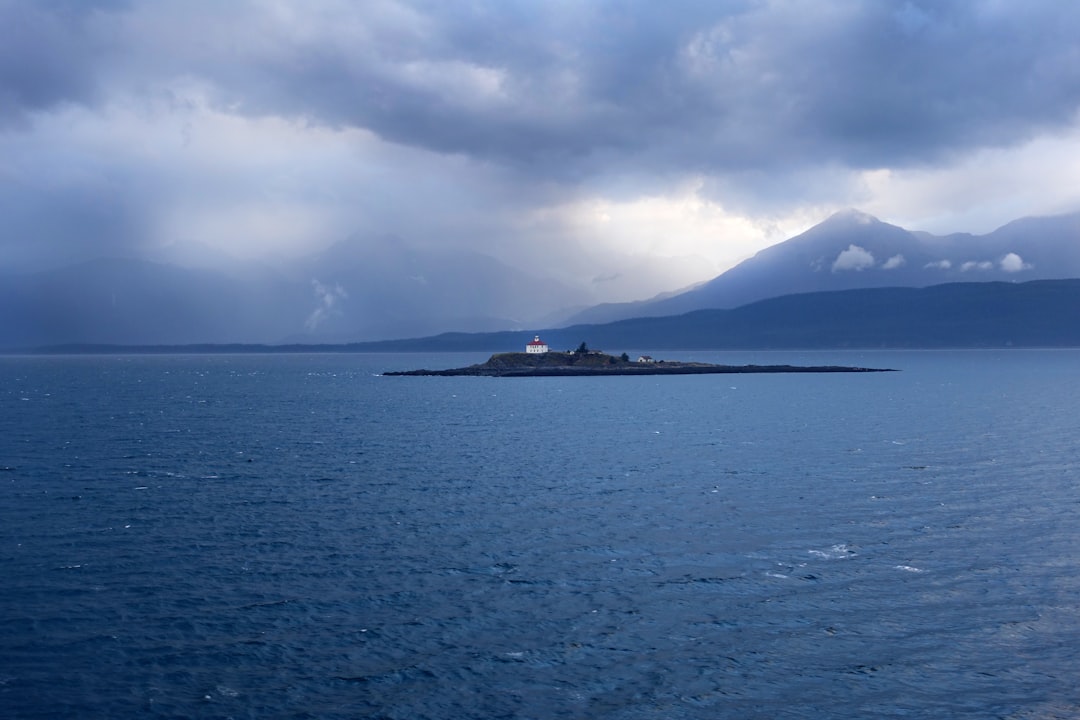 body of water under cloudy sky during daytime