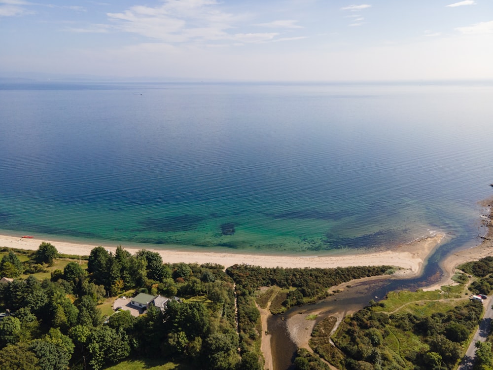 an aerial view of a beach and a body of water