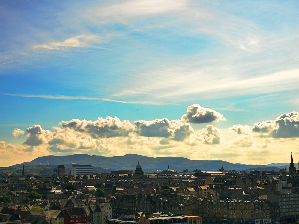 a view of a city with mountains in the background