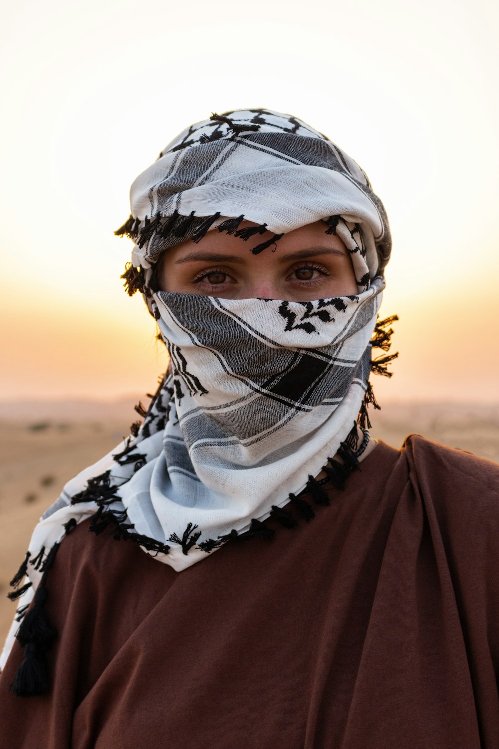 person in black and white floral hijab