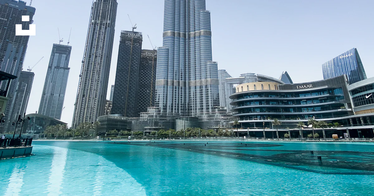 High rise buildings near body of water during daytime photo – Free High ...