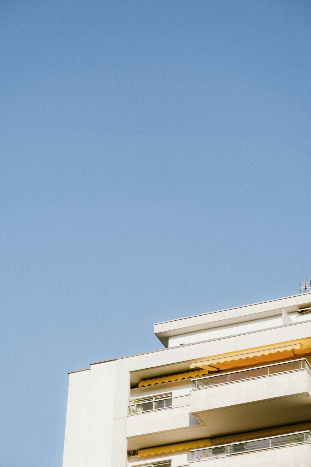 white concrete building under blue sky during daytime