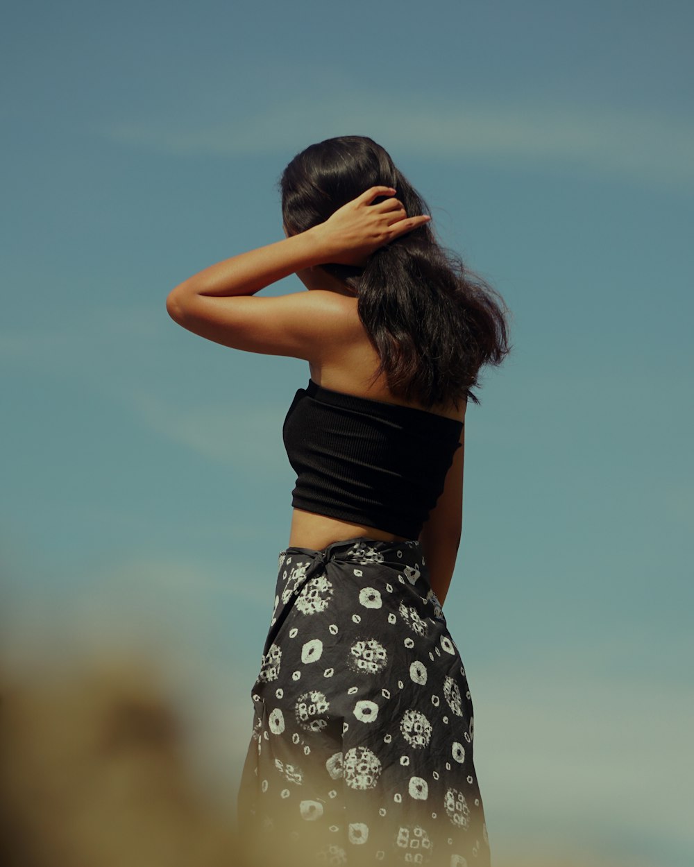 woman in black and white floral skirt