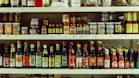 assorted bottles on brown wooden shelf
