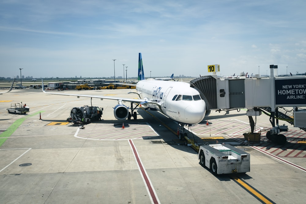 white airplane on airport during daytime