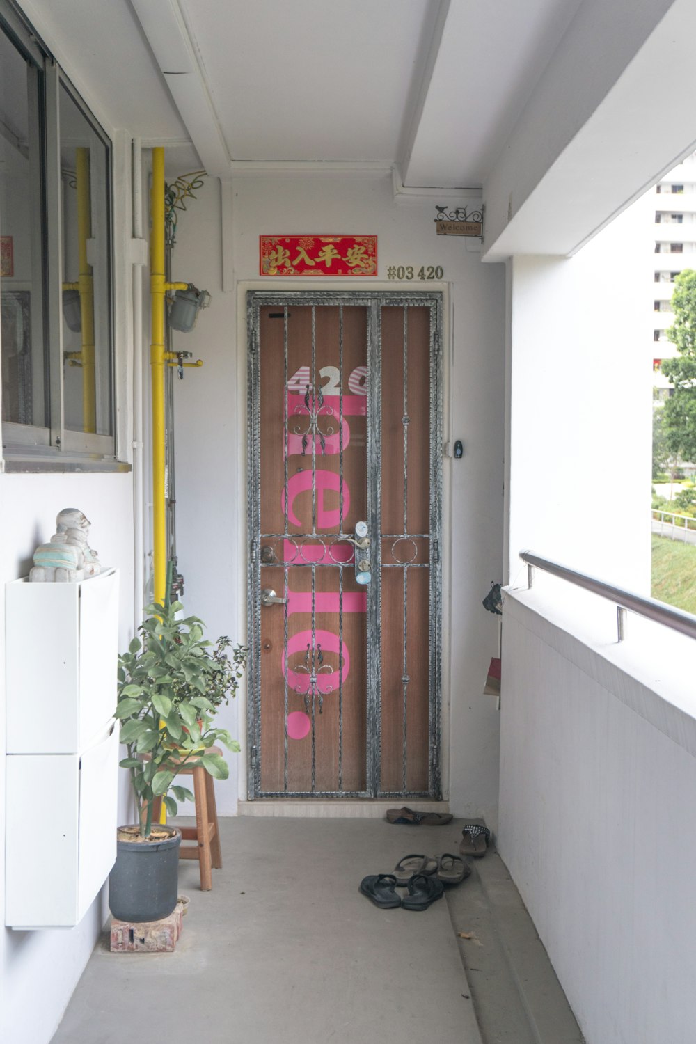 white wooden door with pink curtain