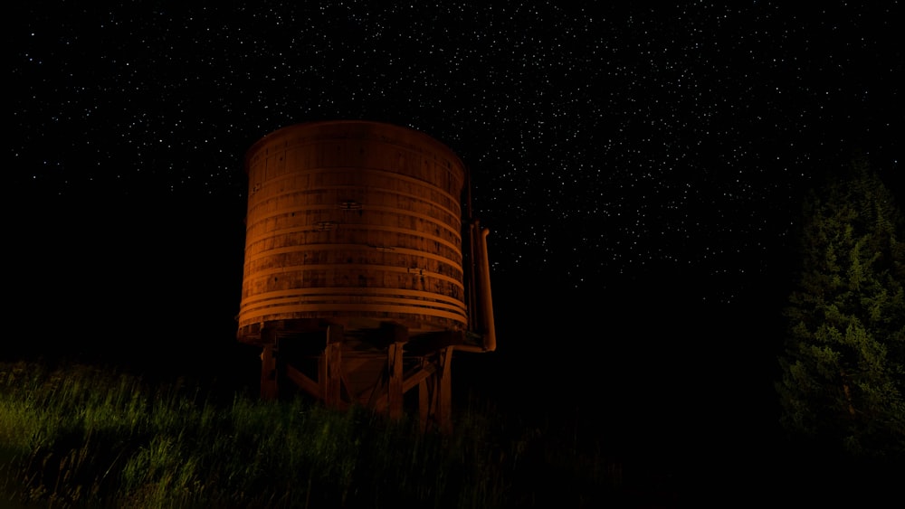 brown steel tank on green grass field during night time