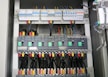 Electrical panel showing well-organized circuit breakers and wiring.