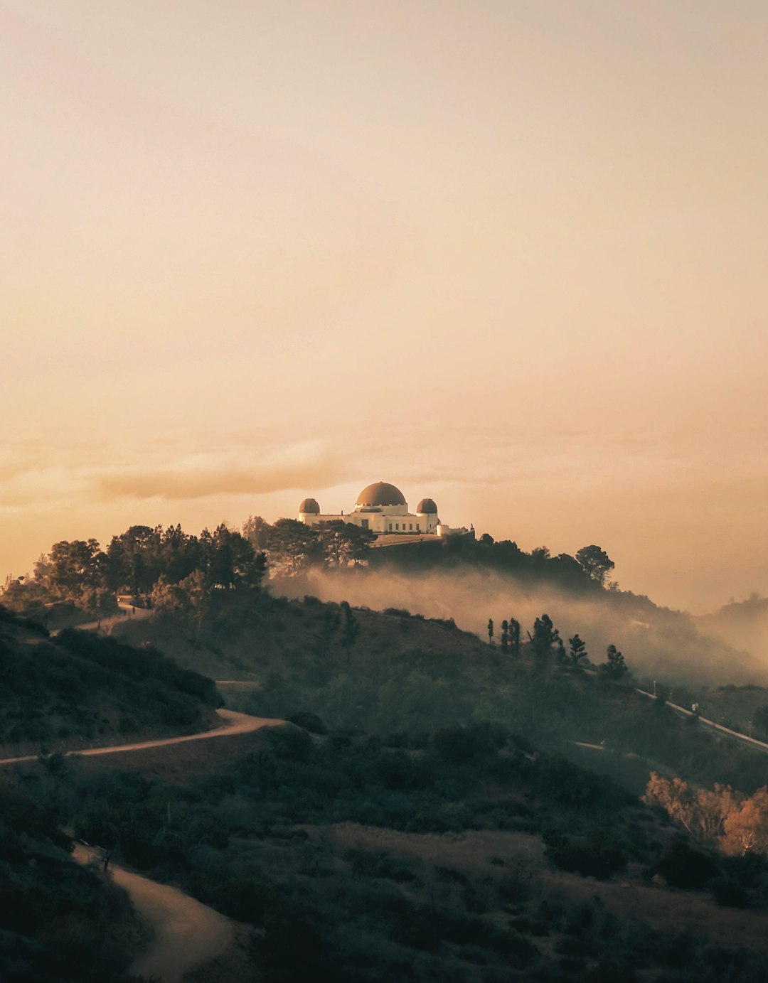 white concrete building on top of mountain during daytime