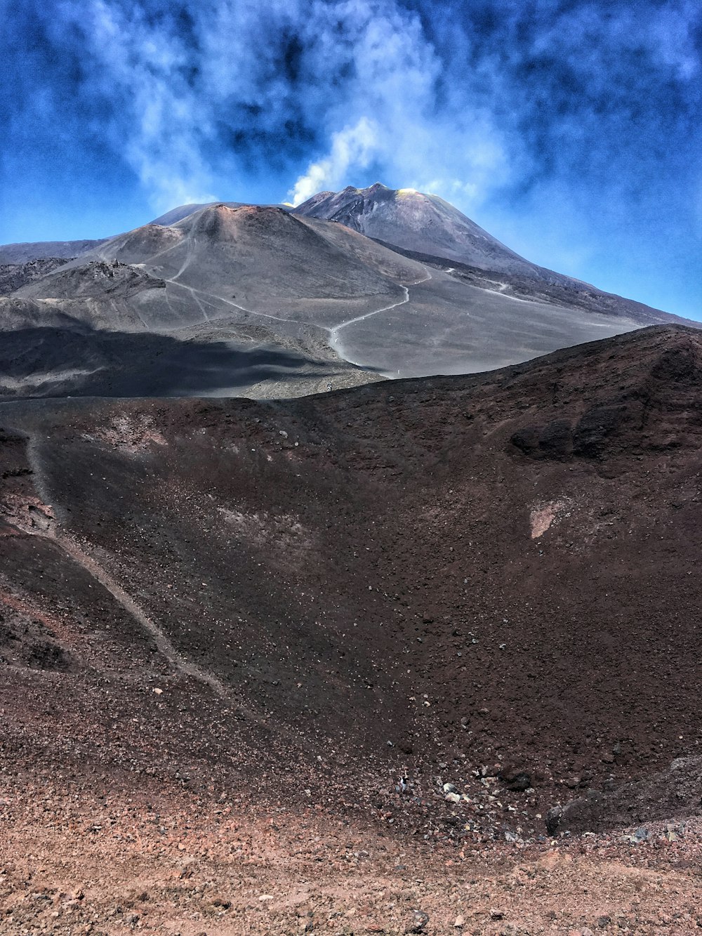 gray and white mountain under white clouds during daytime