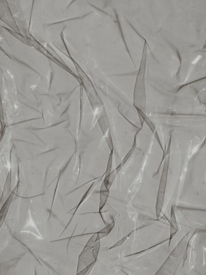 Transparent plastic rolls displayed with sunlight shining through.