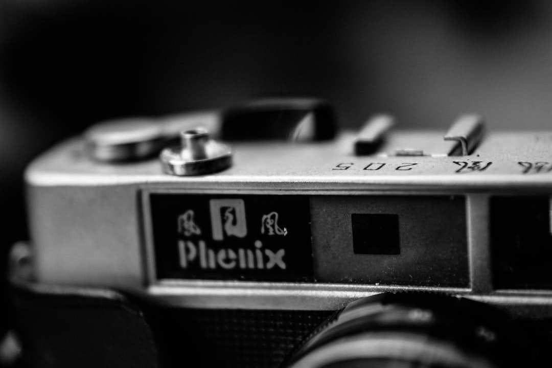 black and silver camera in grayscale photography