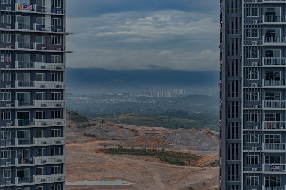 high rise building on brown mountain under blue sky during daytime