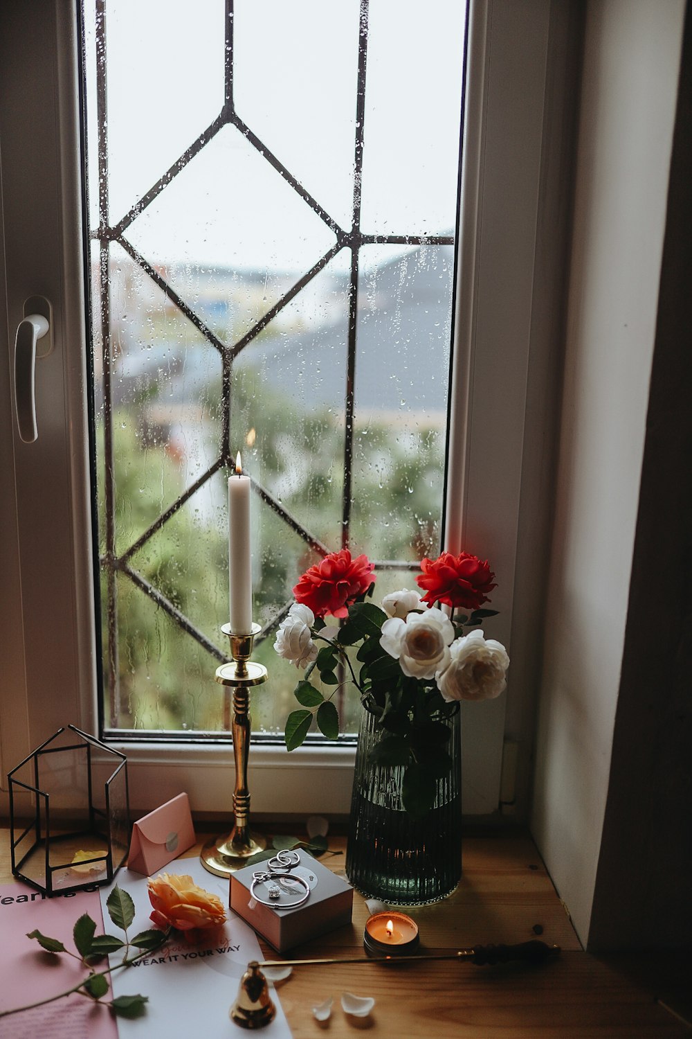 red and white roses in vase on table