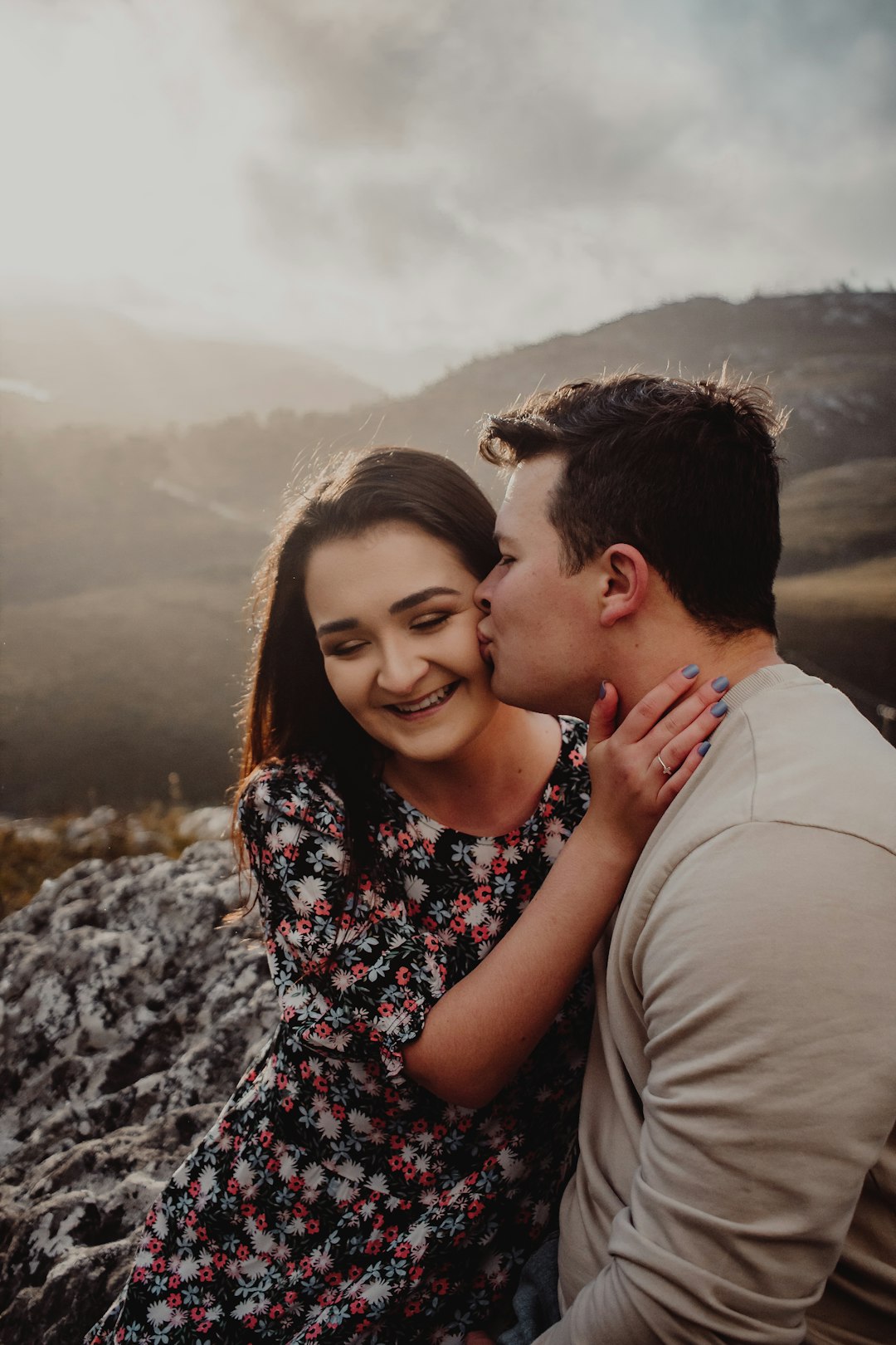 man and woman kissing during daytime