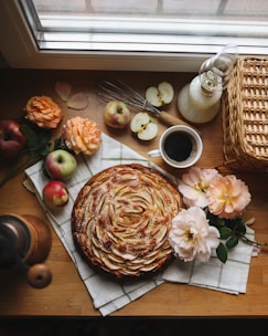 brown and white bouquet of flowers on brown wooden table