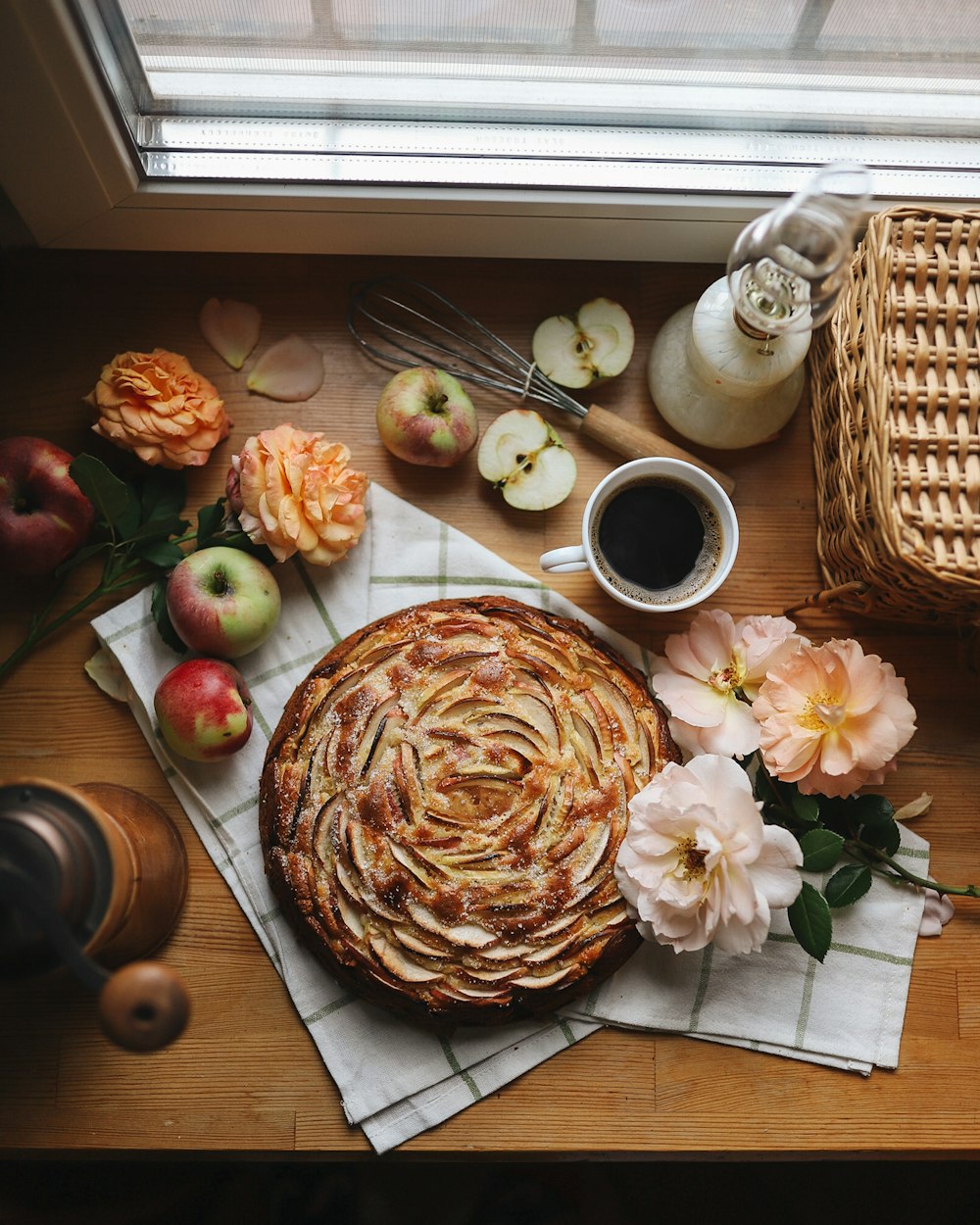 brown and white bouquet of flowers on brown wooden table