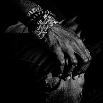 Close-up of a sleek black knee brace with textured anti-slip material wrapping snugly around a bent knee.