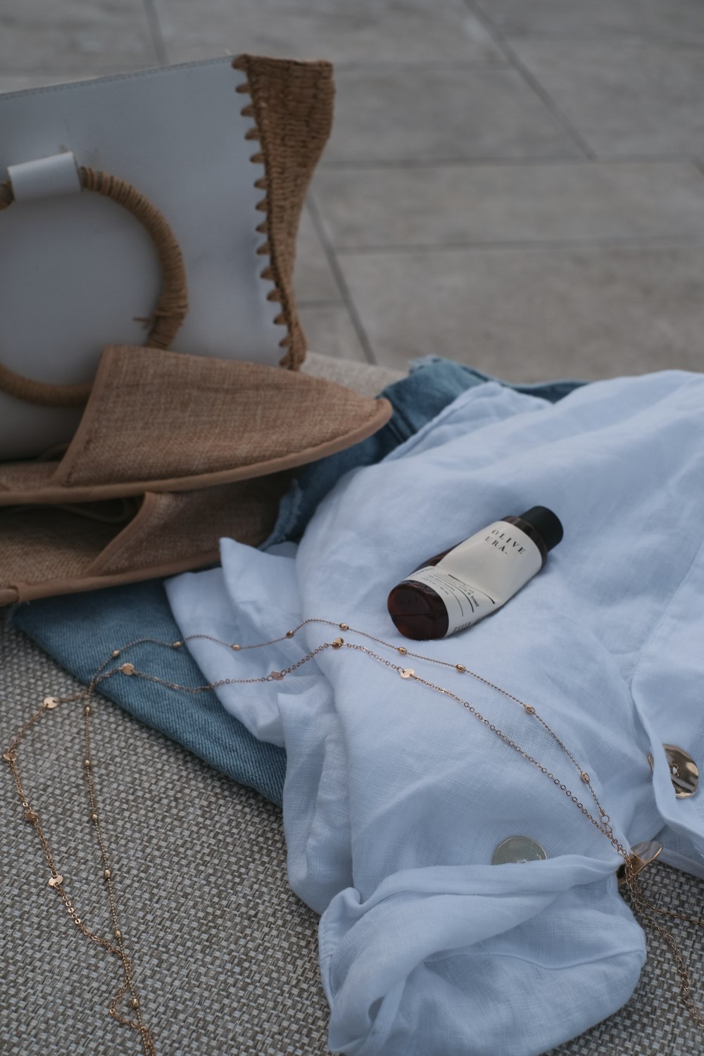 white and black plastic bottle on blue textile