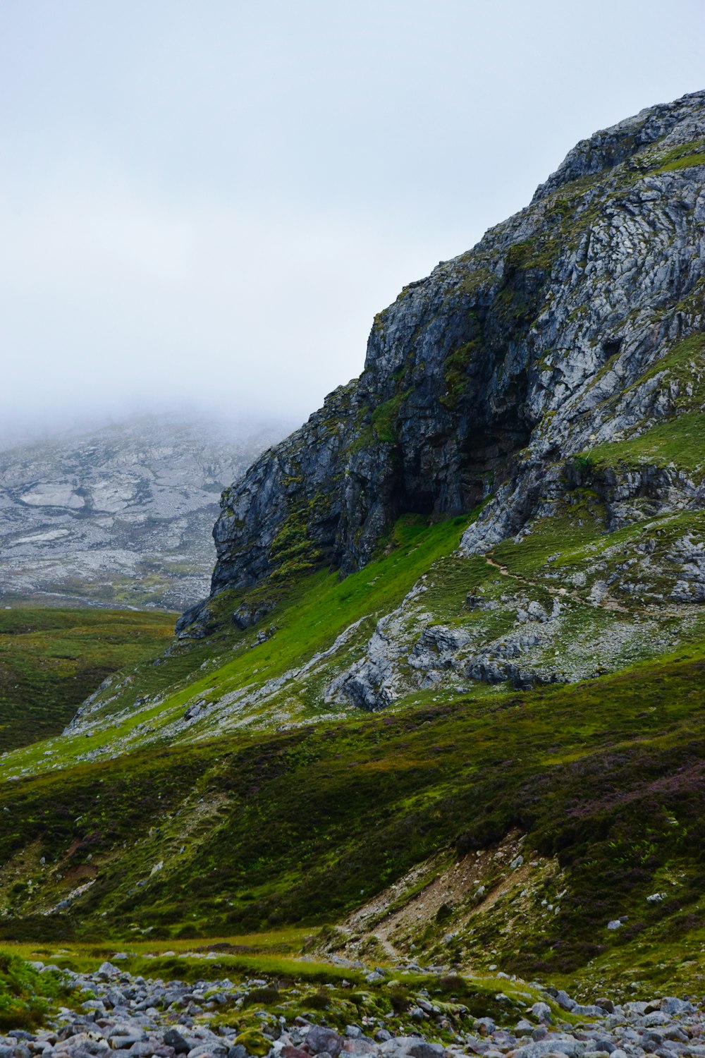 green and gray mountain under white sky during daytime