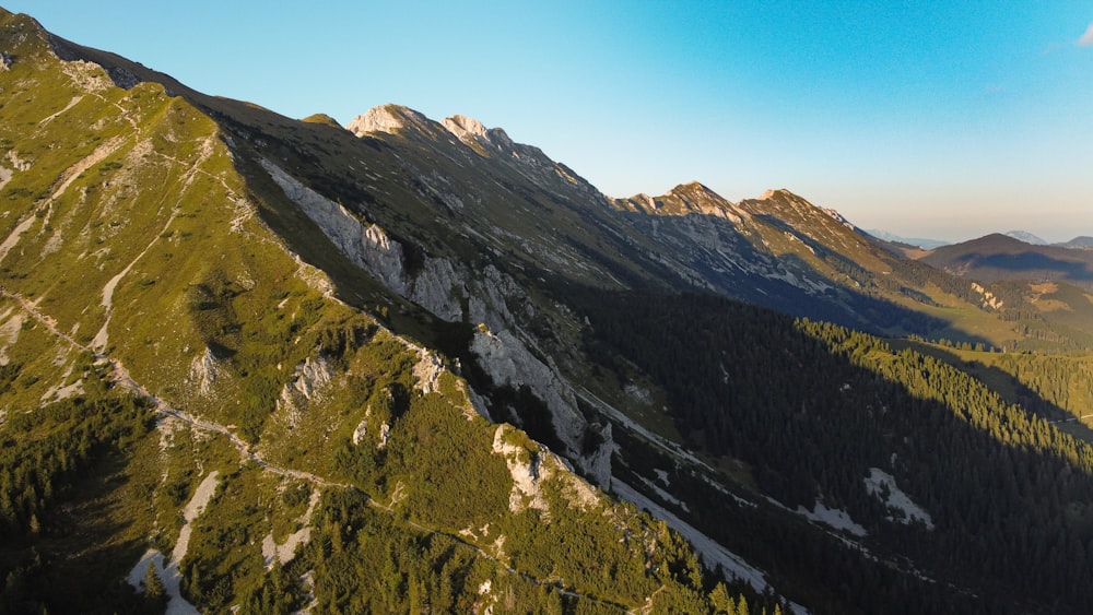 green and brown mountain under blue sky during daytime