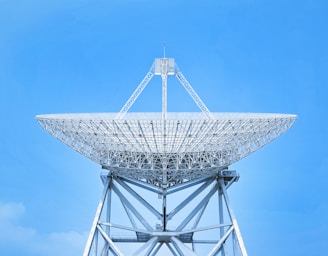 white satellite dish under blue sky during daytime
