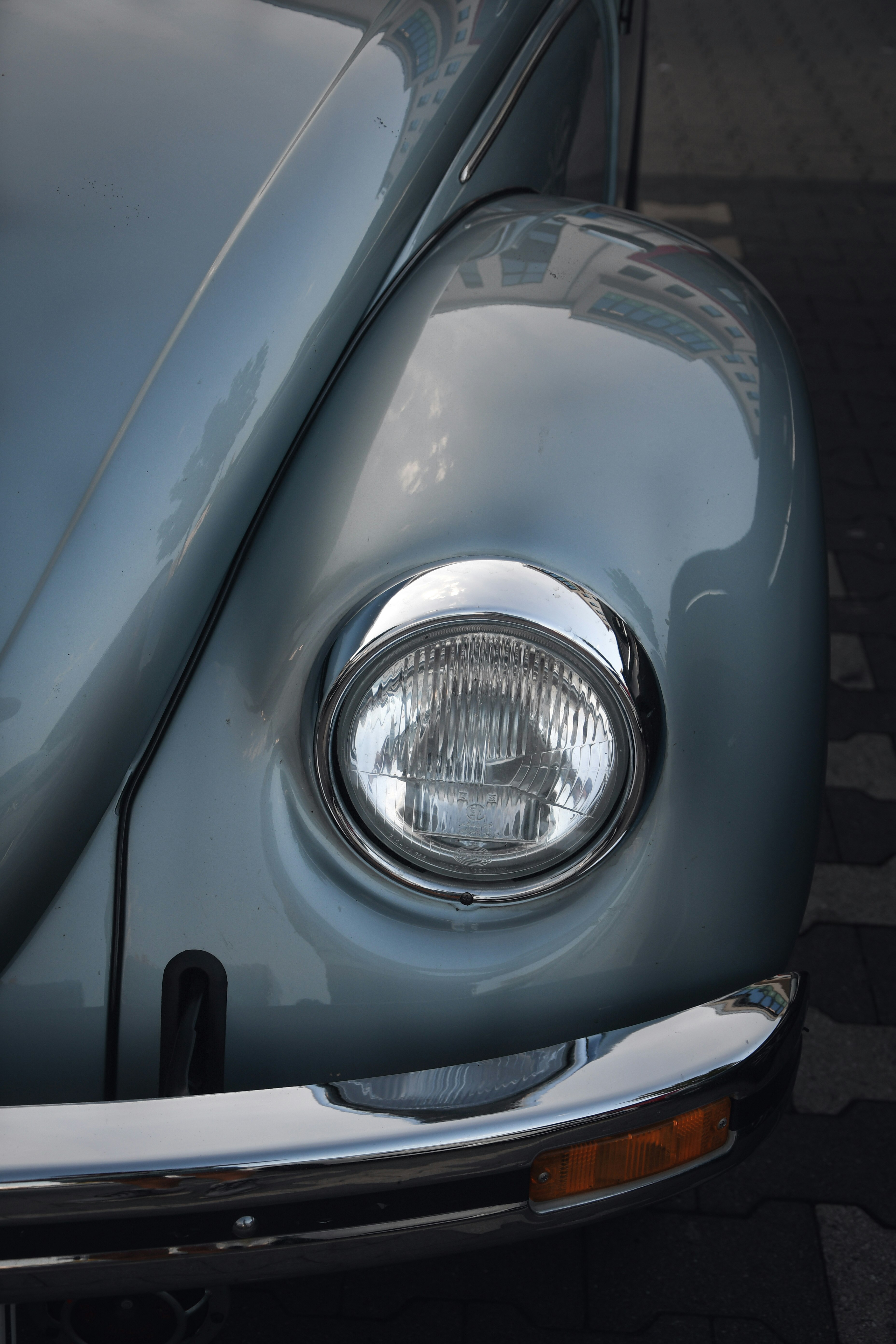 silver car with silver headlight