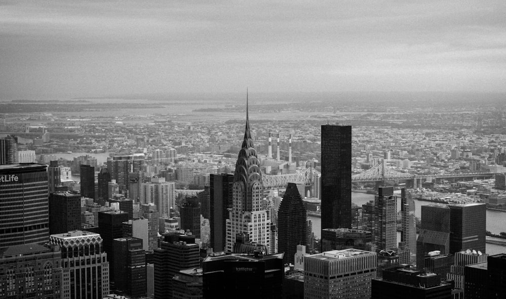 grayscale photo of city buildings