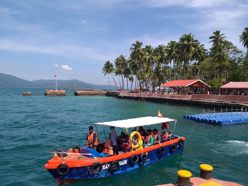 a group of people riding on top of a boat