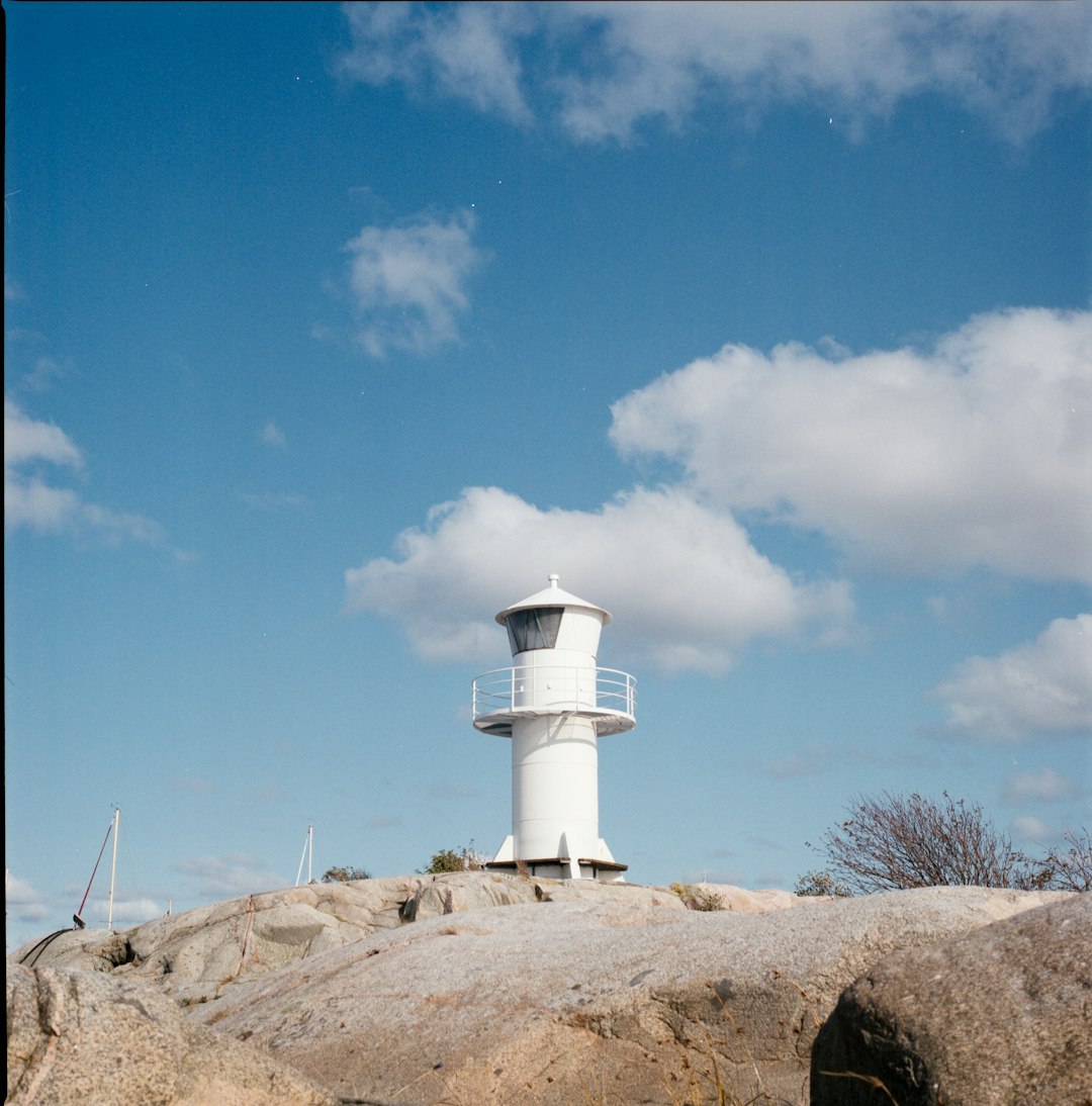 white lighthouse under blue sky during daytime