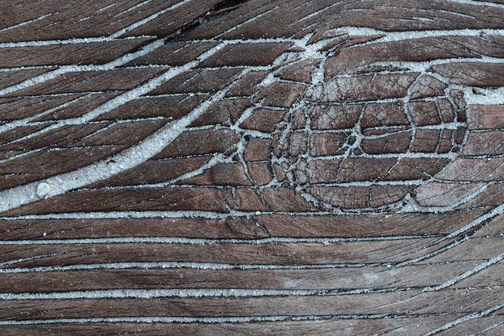 brown wooden surface with black and white paint