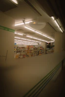 Photo of the Posto Amizade convenience store interior with shelves stocked and warm lighting.
