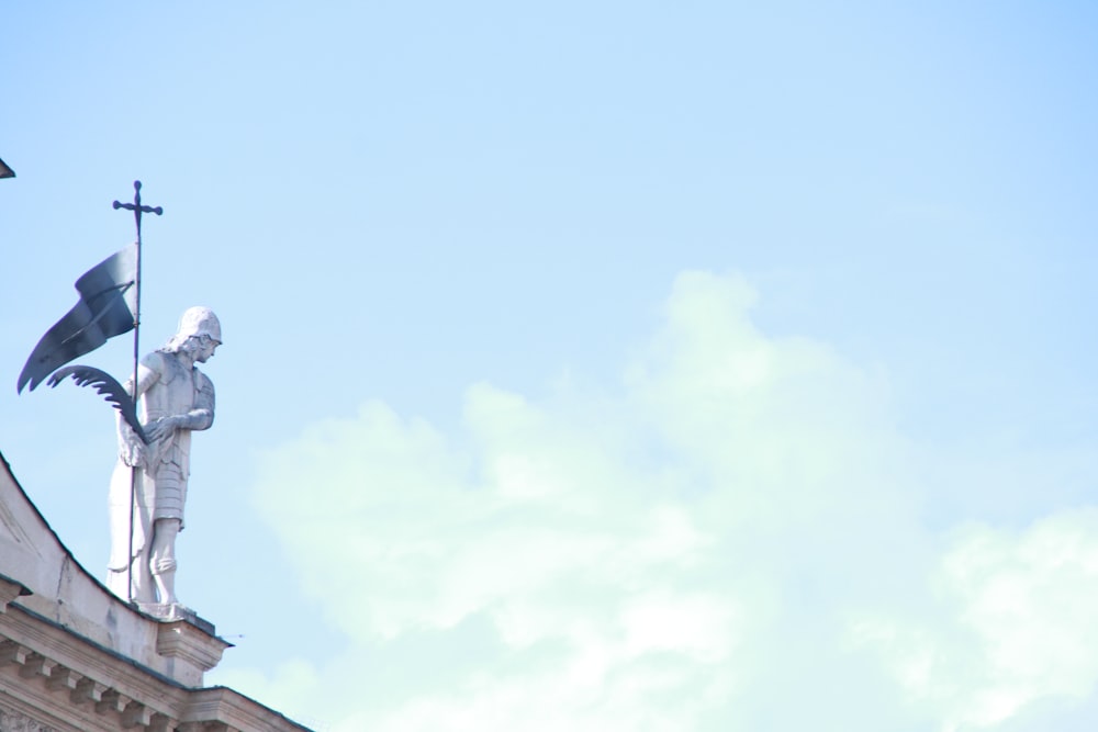 gray concrete statue under blue sky during daytime