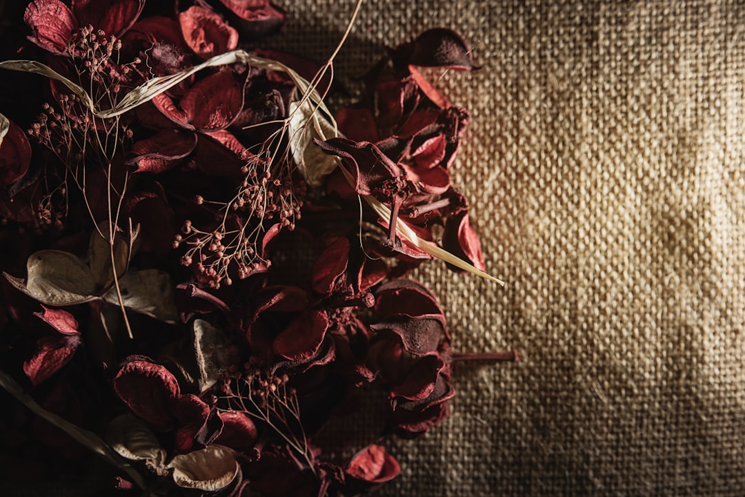 red and brown leaves on gray textile