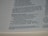A close-up view of a page in a book, likely religious or historical in nature, detailing the descendants of Levi. The page includes numbered verses and footnotes at the bottom.