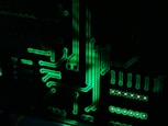 a close up of a computer motherboard in the dark