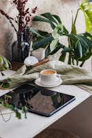 A serene coffee cup beside an open AI research article on a tablet, bathed in natural light.