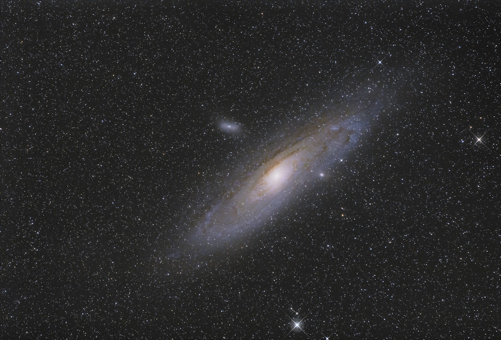 a spiral galaxy with stars in the background