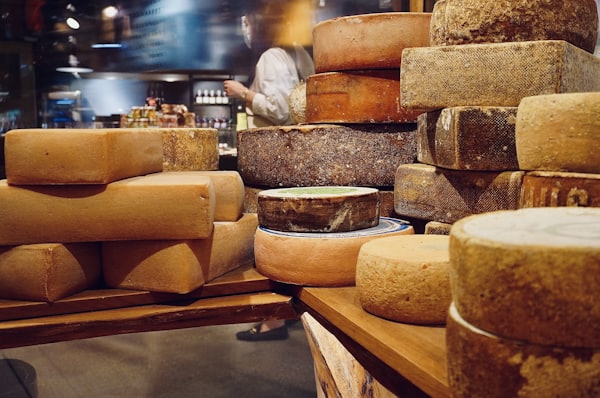 Assortment of different types of Italian cheese on a rustic wooden board