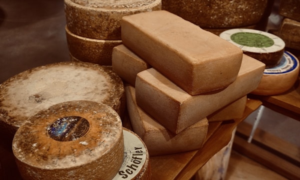 A table topped with lots of different types of bread
