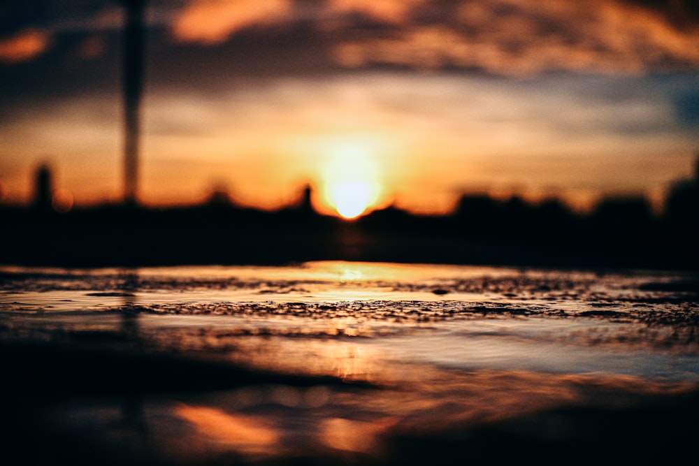 body of water during sunset