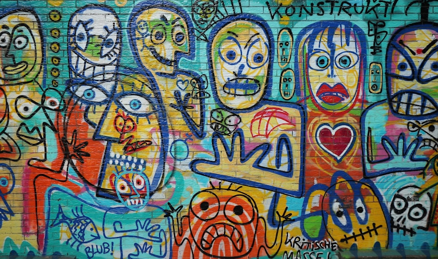 a wall covered in lots of colorful graffiti