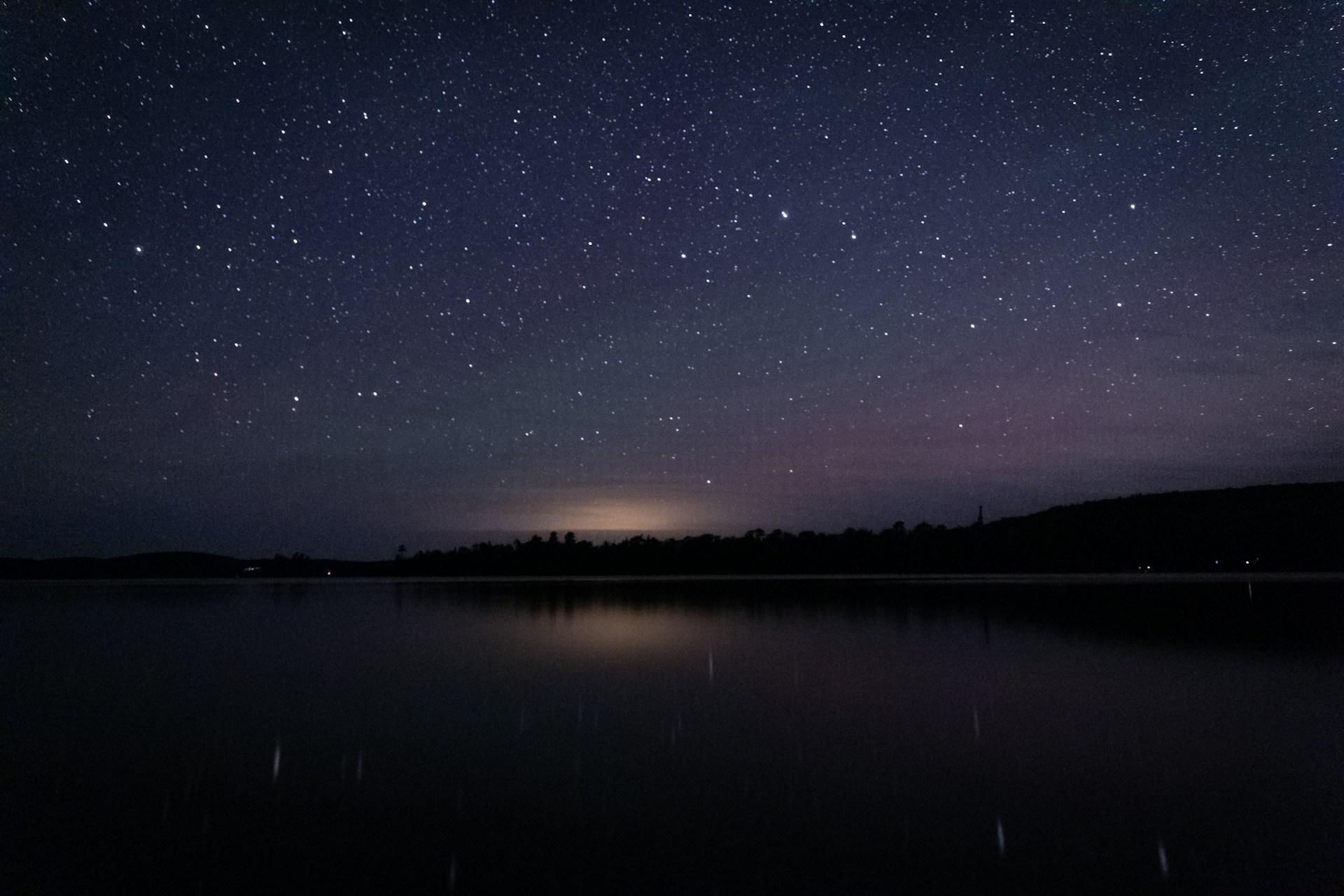 body of water under starry night
