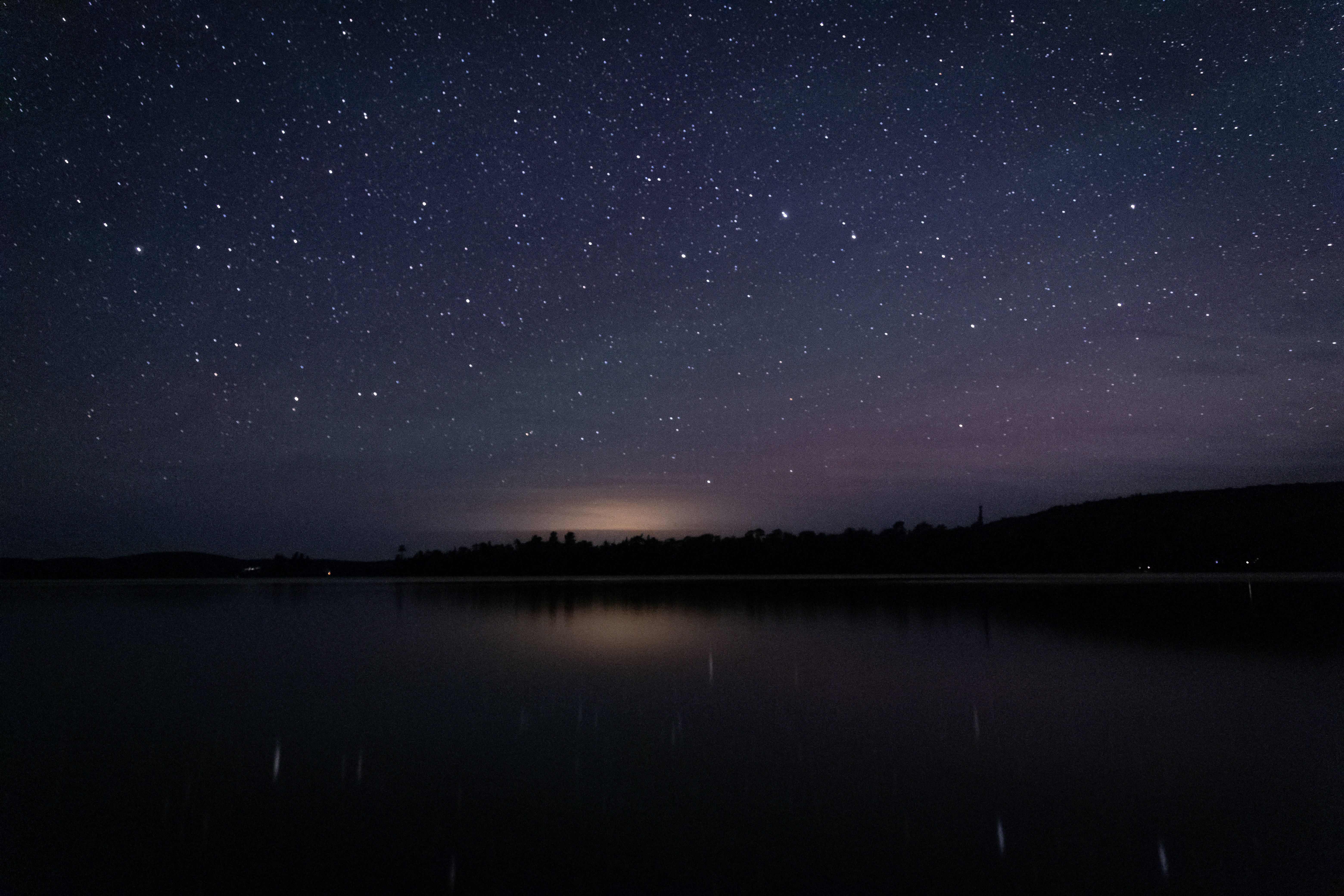 body of water under starry night