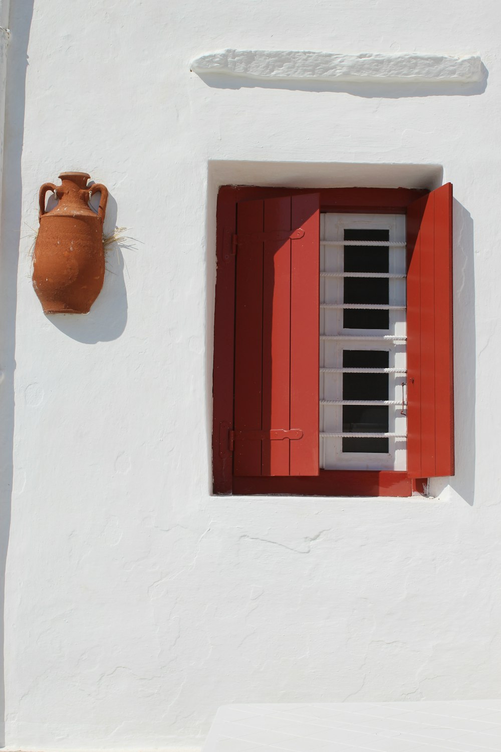 brown wooden window frame with brown sun hat