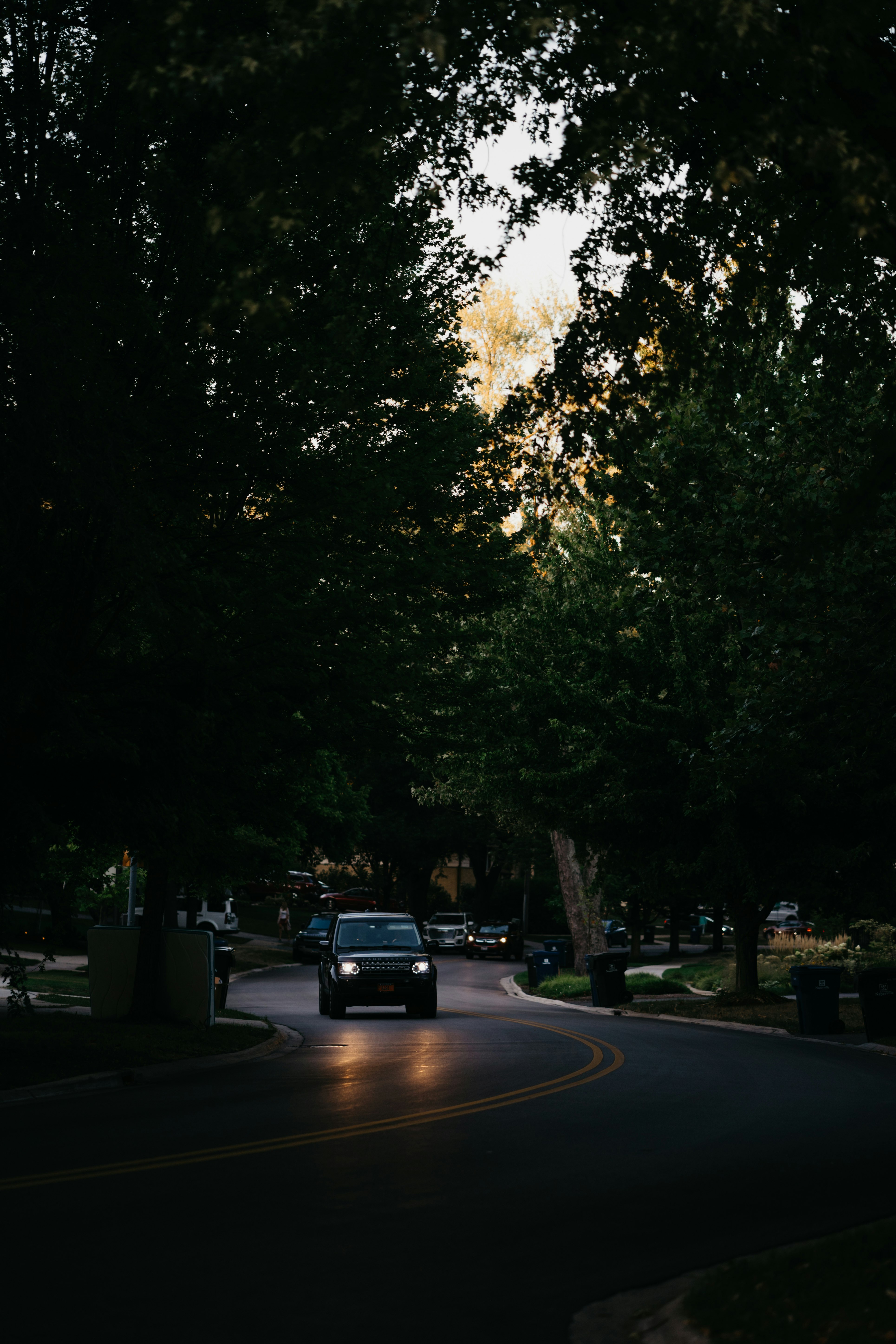 cars parked on side of the road during daytime