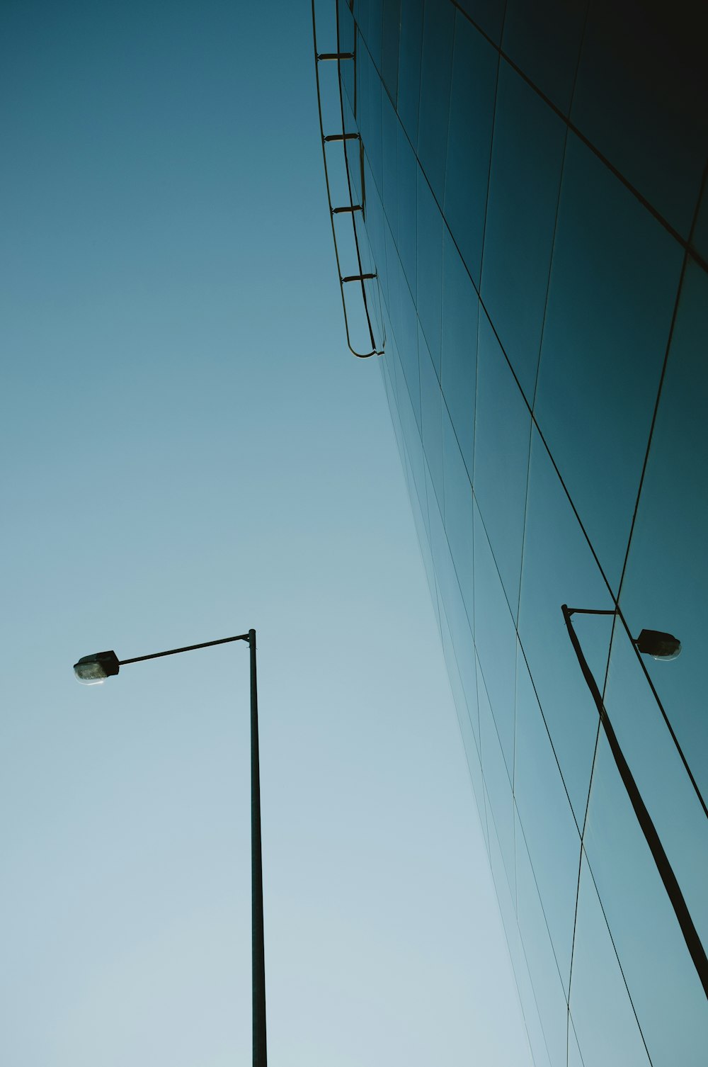 black street light under blue sky during daytime