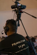 a man sitting in a chair in front of a camera